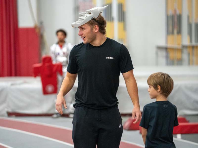 a man wearing a white mask