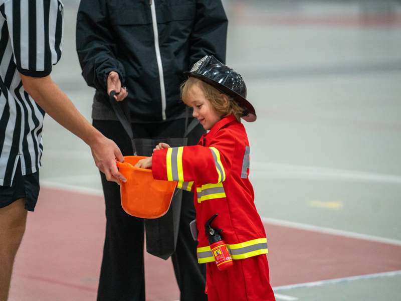 a child in a firefighter outfit