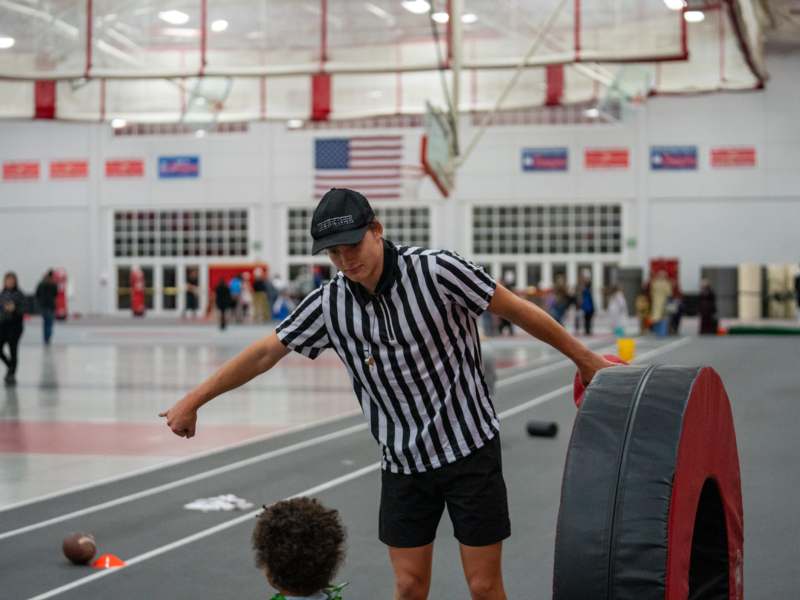 a man pointing at a child