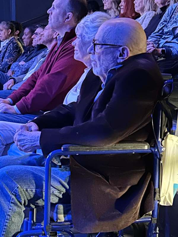 a group of people sitting in a row