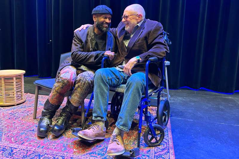 The Hand That Guides: Nathaniel Mary Quinn '00/Greg Huebner H'77 Exhibition Opening - two men sitting on a wheelchair