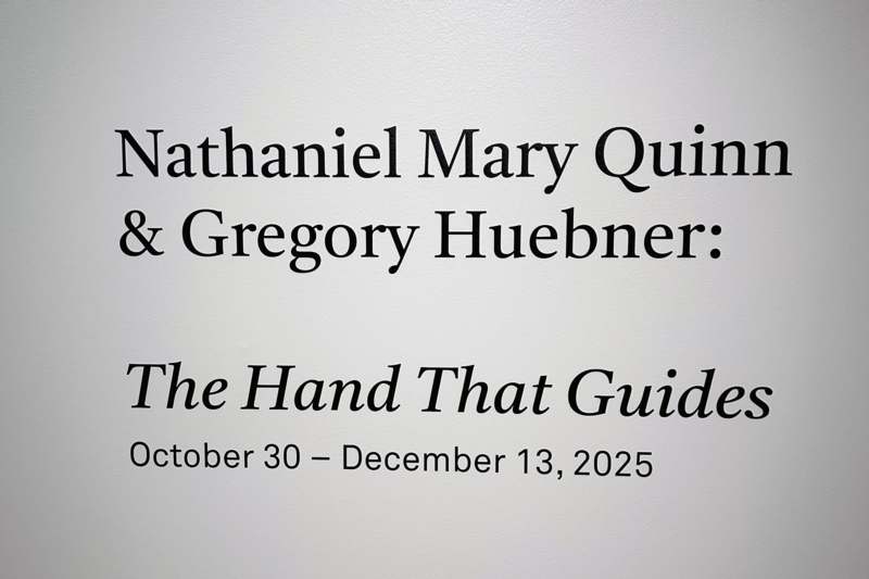 a white sign with black text