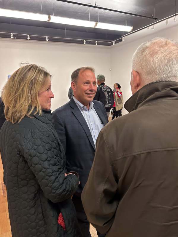 a group of people standing in a room