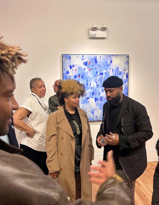 a group of people standing in a room