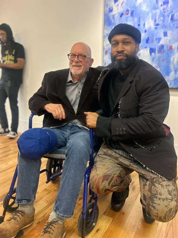 two men posing for a picture