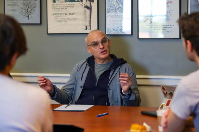Hernan Diaz in ENG 213 - a man sitting at a table with a group of people
