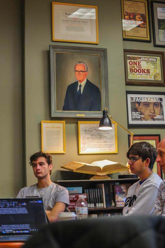 a group of people sitting at a table