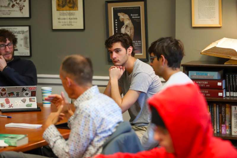 a group of people sitting at a table
