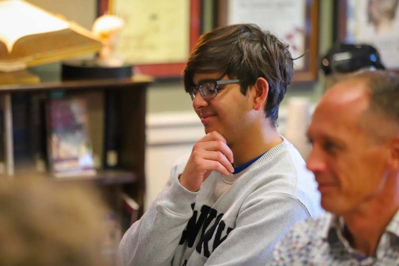 a man with his hand on his chin