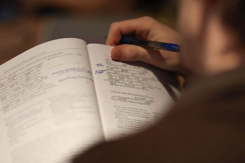 a person writing in a book