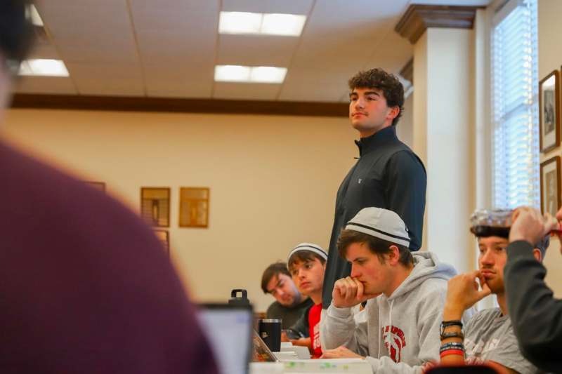 a man standing in front of a group of people