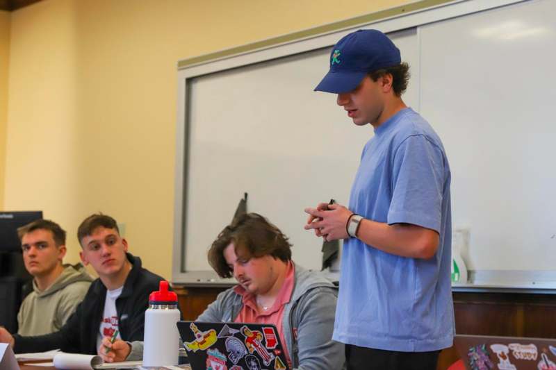 a man standing in front of a group of people