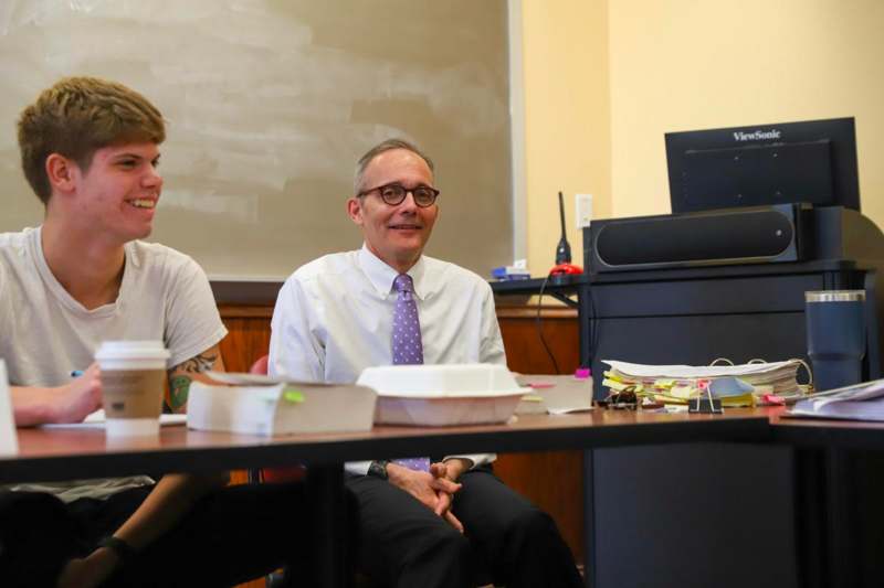 a man and woman sitting at a table