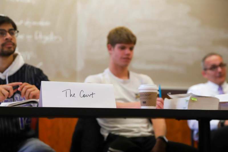 PPE 333 Mock Trial with Associate Professor Scott Himsel - a group of people sitting at a table