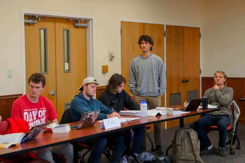 a man standing in front of a group of people