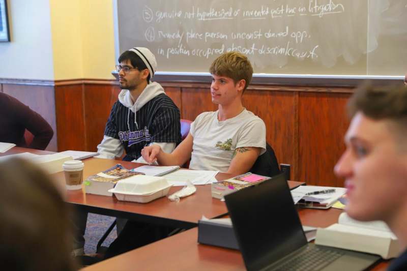 a group of people sitting at a table