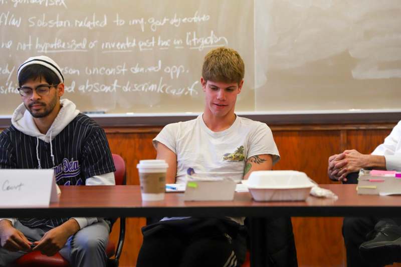 a group of people sitting at a table