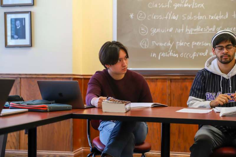 a group of people sitting at a table