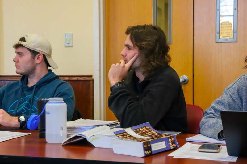 a group of people sitting at a table