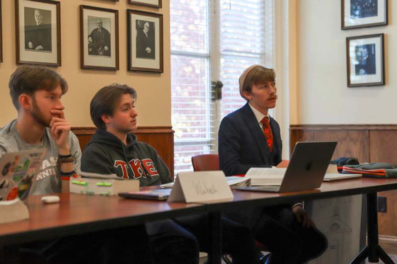 a group of people sitting at a table