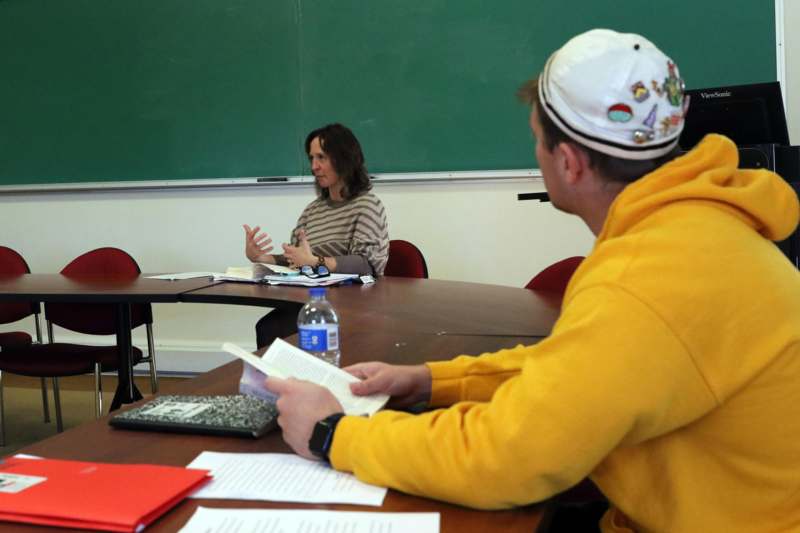 a man and woman sitting at a table