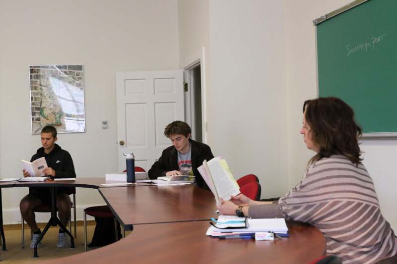 a group of people sitting at a table