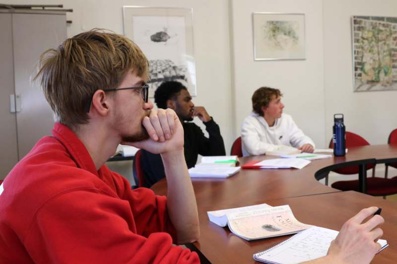 a group of people sitting at a table