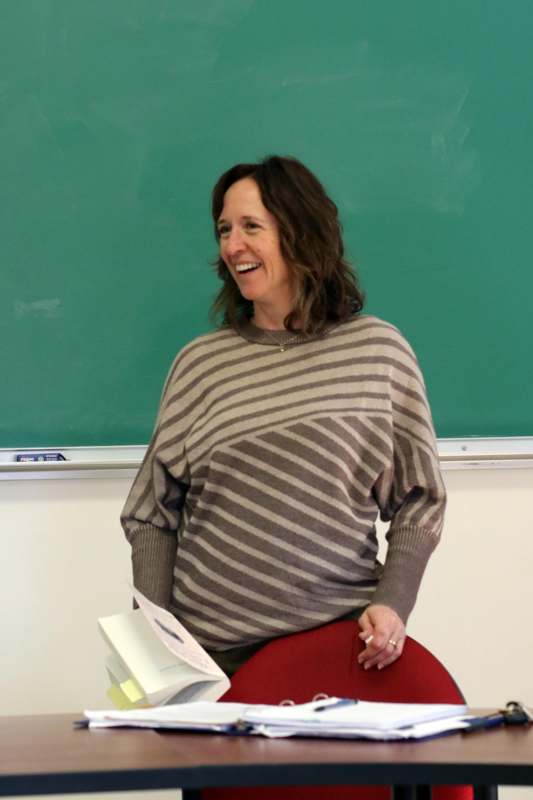a woman in a striped sweater