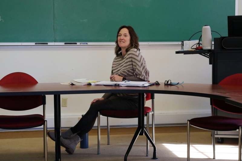 a woman sitting at a table