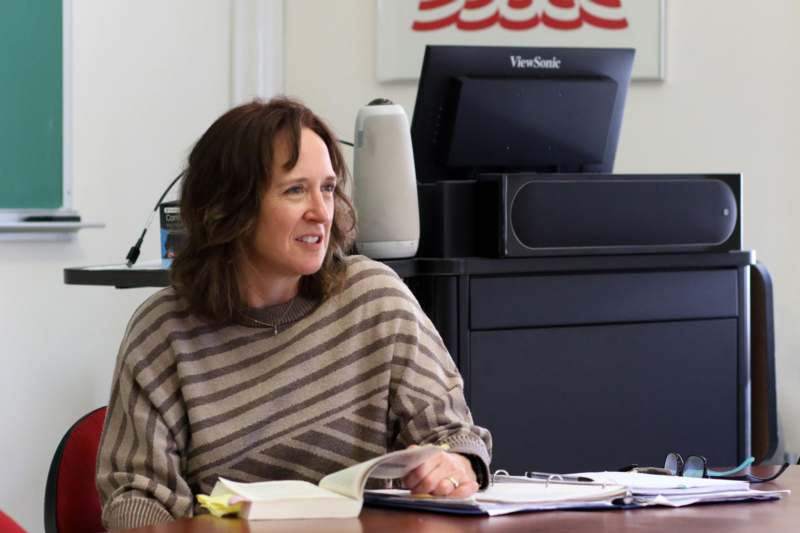 a woman sitting at a desk