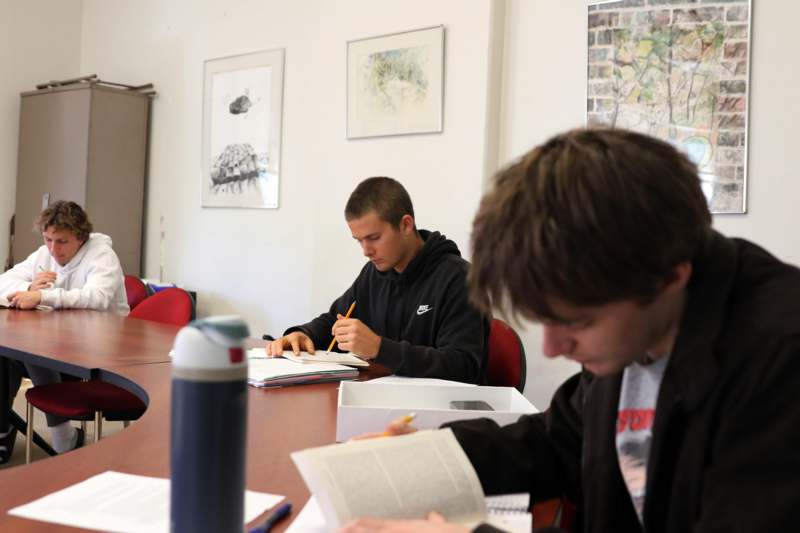 a group of people sitting at a table
