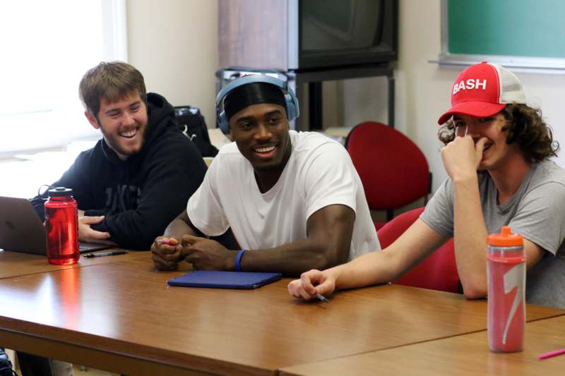 a group of people sitting at a table