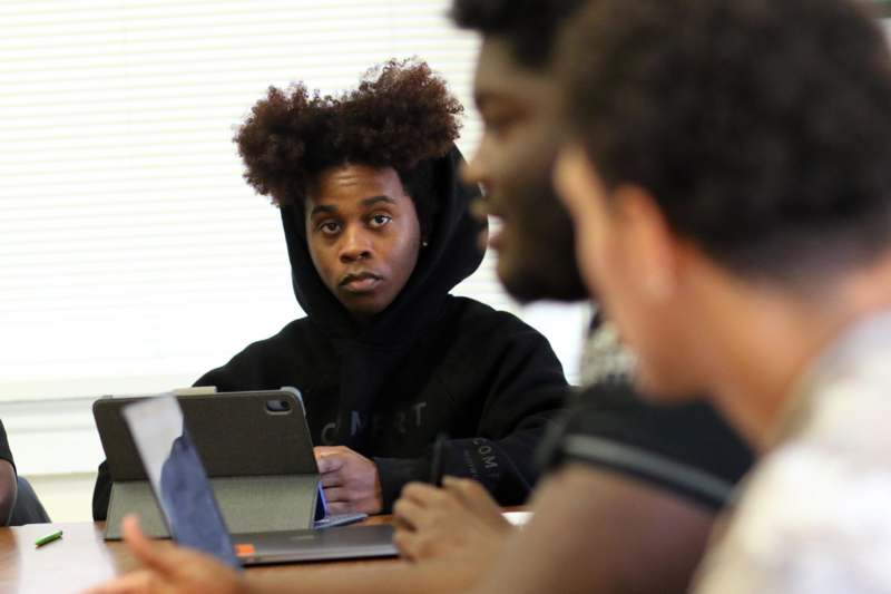 a group of people sitting around a table