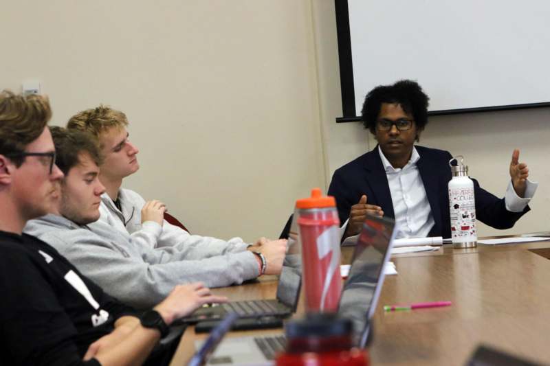 a group of people sitting at a table