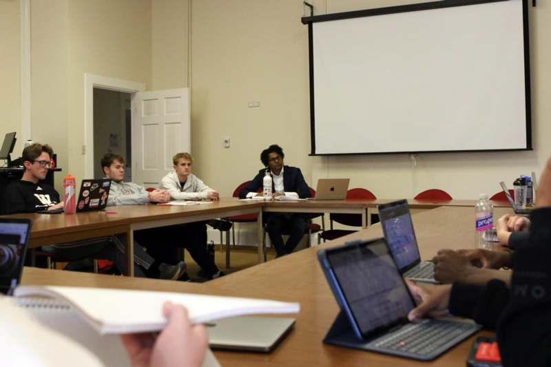 a group of people sitting at a table