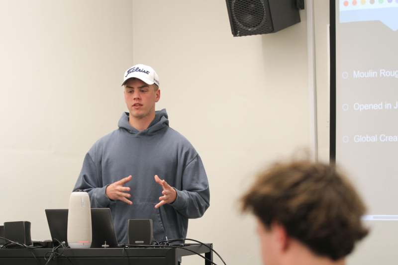 a man standing in front of a computer