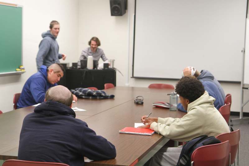 a group of people sitting around a table