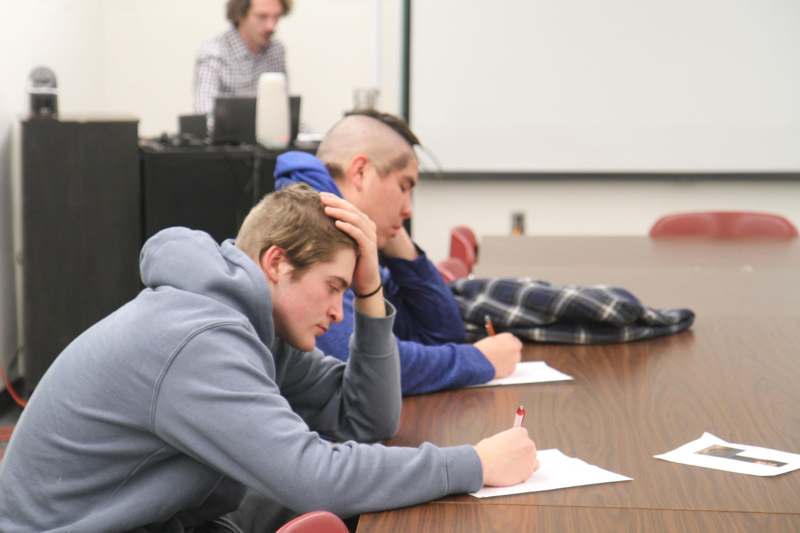 a group of people sitting at a table