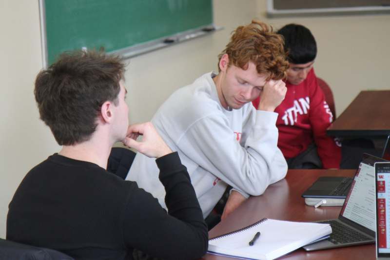 a group of people sitting at a table