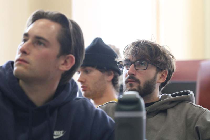 a group of men sitting in a room