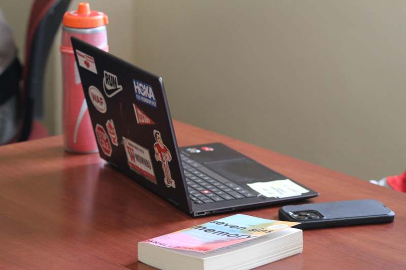 a laptop and a book on a table