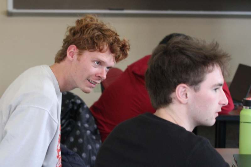 a man looking at another man