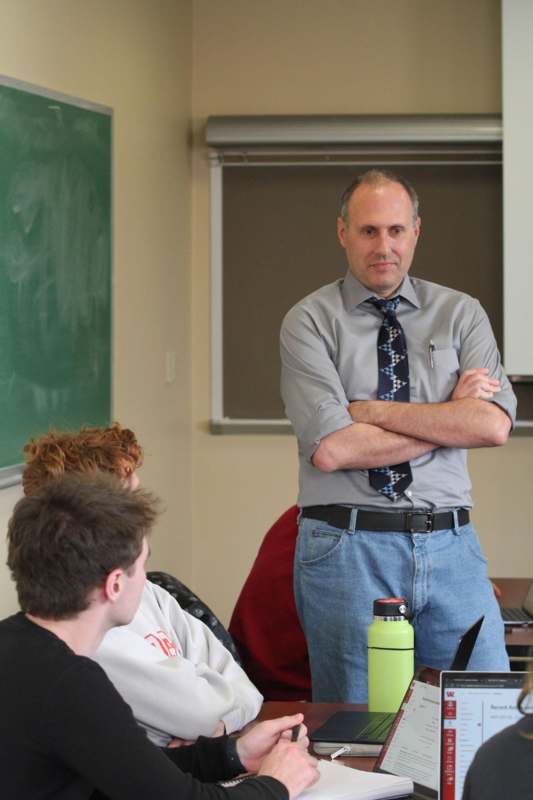 a man standing in front of a group of people