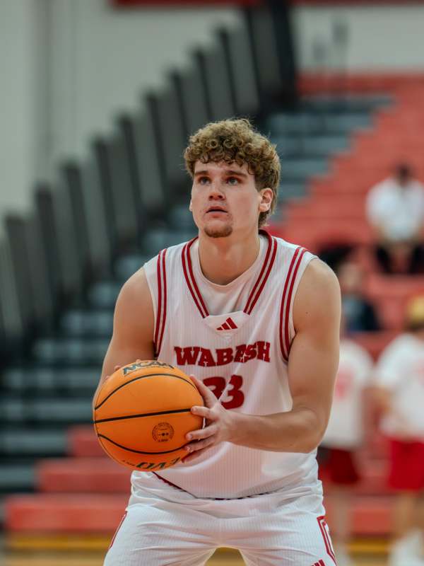 a man holding a basketball