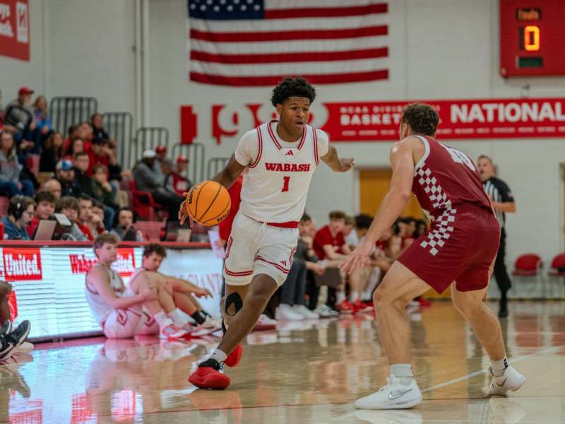 a basketball player dribbling a basketball