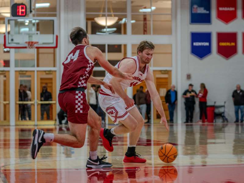 a group of men playing basketball