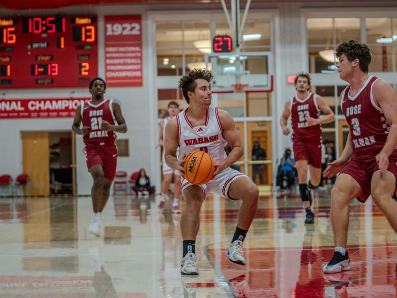 a group of men playing basketball