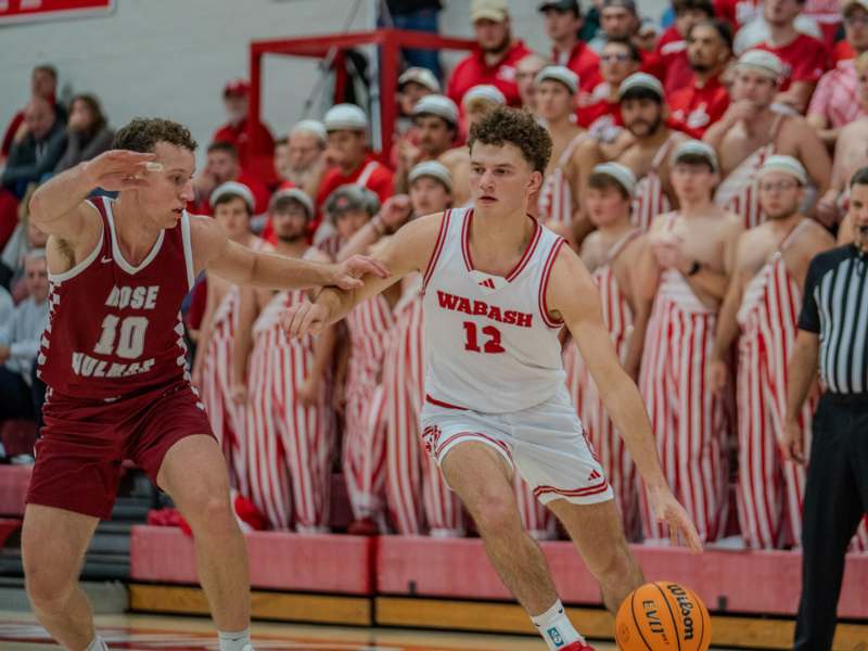 a group of men playing basketball