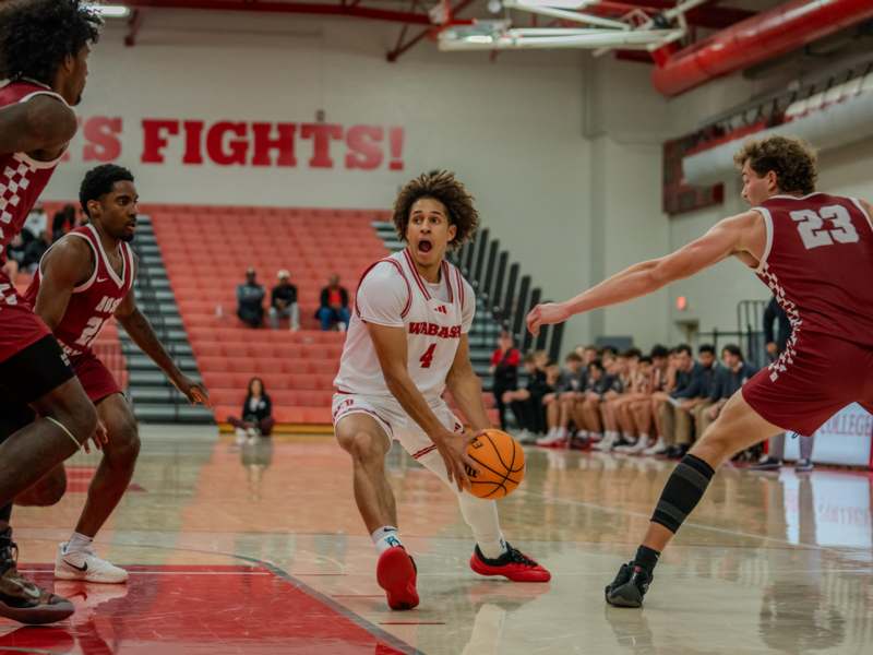 a group of men playing basketball
