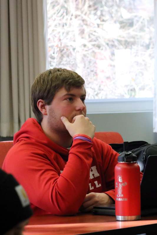 a man in a red sweatshirt